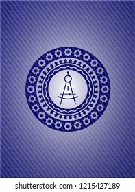 drawing compass icon inside denim background
