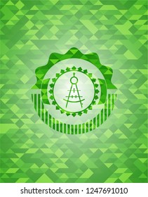 drawing compass icon inside green emblem with mosaic background