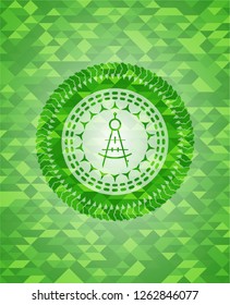 drawing compass icon inside green emblem with mosaic background