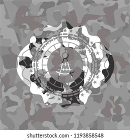 drawing compass icon inside grey camo emblem