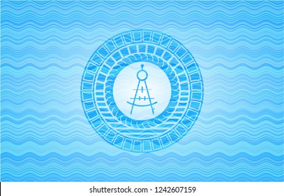 drawing compass icon inside light blue water emblem background.