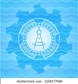 drawing compass icon inside light blue water wave badge background.