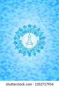 drawing compass icon inside light blue emblem. Mosaic background