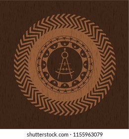 drawing compass icon inside retro wooden emblem