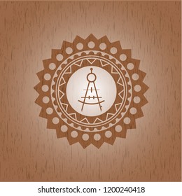 drawing compass icon inside retro style wood emblem