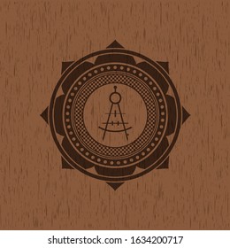 drawing compass icon inside retro style wood emblem
