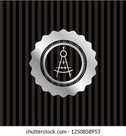drawing compass icon inside silver emblem