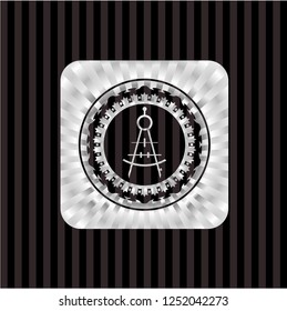 drawing compass icon inside silver emblem