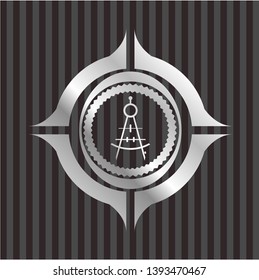 drawing compass icon inside silver emblem