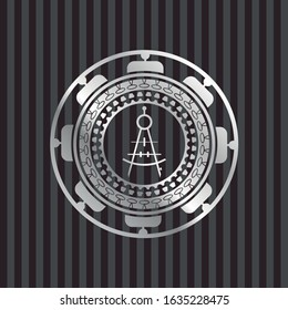 drawing compass icon inside silver emblem