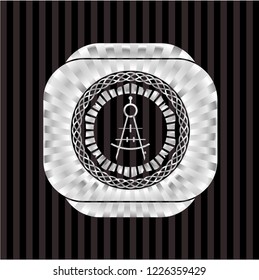 drawing compass icon inside silvery badge