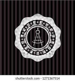 drawing compass icon inside silvery badge