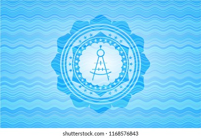 drawing compass icon inside sky blue water wave style emblem.