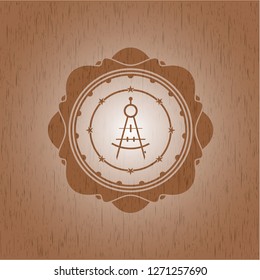 drawing compass icon inside wood badge or emblem