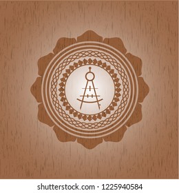 drawing compass icon inside wooden emblem. Vintage.