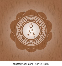 drawing compass icon inside wooden emblem