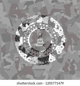 drawing compass icon on grey camouflaged texture