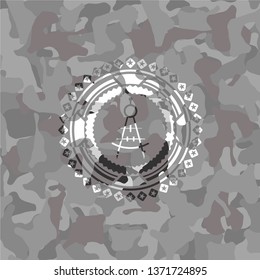 drawing compass icon on grey camouflage pattern
