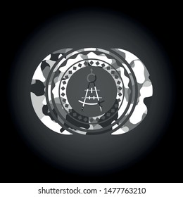 drawing compass icon on grey camouflaged texture