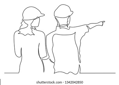 Drawing a continuous line of young man and woman standing back with workers engineers in helmets. points with his finger. The concept of construction and sale of buildings and houses.