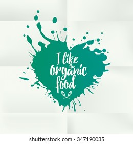 Drawing heart made with splashes with the text "I like the organic food". vector