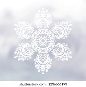 Drawing mandala. White snowflake on the watercolor background.