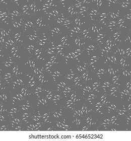 Drawing randomly scattered strokes with spots. Vector seamless pattern.Black and white