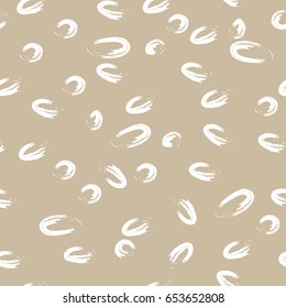 Drawing scattered circles.Vector seamless pattern.Light brown and white