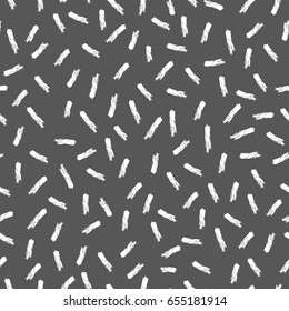 Drawing scattered sticks. Vector seamless pattern.White and black