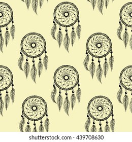 Drawing of a seamless pattern with black line art of native american dreamcatcher with feathers and beads  on a peach color  background