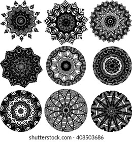 Drawing of a set of black and white mandalas in indian style