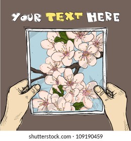 Drawing of a sheet of paper with blossom cherry flowers illustration in hands. Vector.