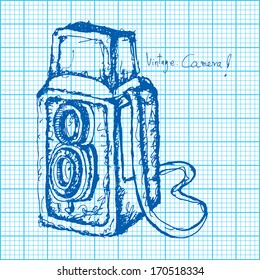 drawing of vintage camera on graph paper vector 