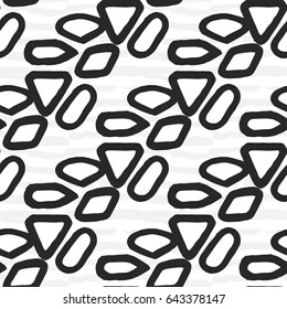 drawn black and white graphic pattern of oval spots and textures on a white background