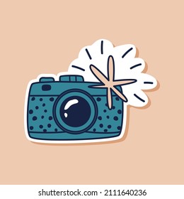 Drawn blue camera doodle sticker. Travel camera isolated sticker. Vector illustration