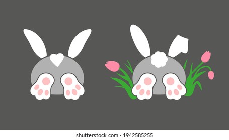 Drawn funny bunny, ears, paws and tail.
Rabbit character. The hare is sticking out of the hole. The hare is hiding in tulip flowers.