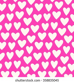 Drawn multicolor heart silhouettes on rose background. Symbol of love in pink seamless pattern