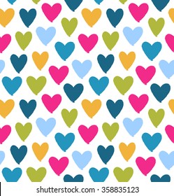 Drawn multicolor heart silhouettes on white background. Saint Valentine's Day. Symbol of love on decorative seamless pattern