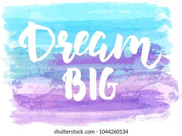 Dream big hand lettering phrase on watercolor imitation color brushed lines.  Blue and purple colored. Modern calligraphy inspirational quote. Vector illustration.