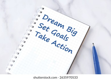 Dream Big, Set Goals, Take Action - text words in opened notebook with pen, life and business motivational inspirational concept