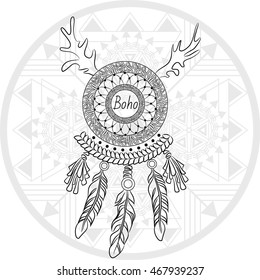 Dreamcatcher with feathers on the shaman drum background. Boho chic style.