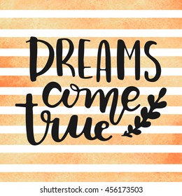"Dreams come true" hand drawn lettering on watercolor stripes. 