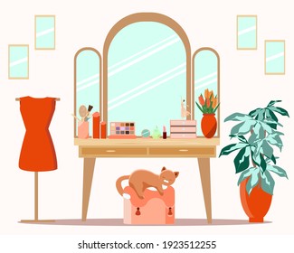 Dressing table in the women's room with a cat and flowers