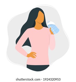 Drink more water and healthy lifestyle concept. Young beautiful woman drinks water from a bottle. 