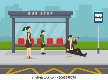 Drinking of alcohol in public place prohibited. Sad business manager or worker drinking alcohol at bus stop. Drunk male character sitting on the floor and holding bottle. Flat vector illustration.