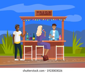 Drinking coffee and eating in street cafe. Friends meeting. Crowded outdoor restaurant or bar in city. Relaxing in cafe restaurant alcohol street bar meeting. Barman making drinks. Outdoor festival