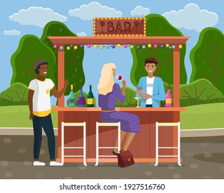 Drinking coffee and eating in street cafe. Friends meeting. Crowded outdoor restaurant or bar in city. Relaxing in cafe restaurant alcohol street bar meeting. Barman making drinks. Outdoor festival
