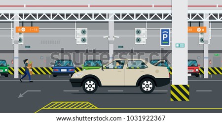 The driver is looking for parking in the building.