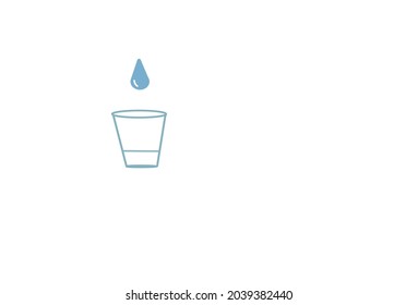 Drop above the glass on a white surface