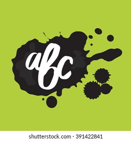 A drop of black ink, white painted by brush, letters. Light green background with black blot, white letters